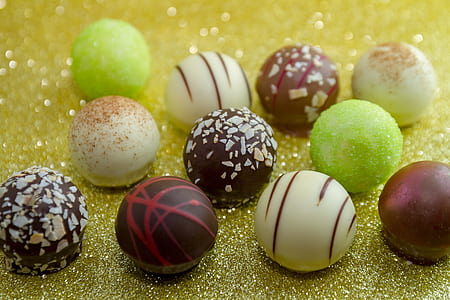 assorted-color coated chocolates on beige surface thumbnail