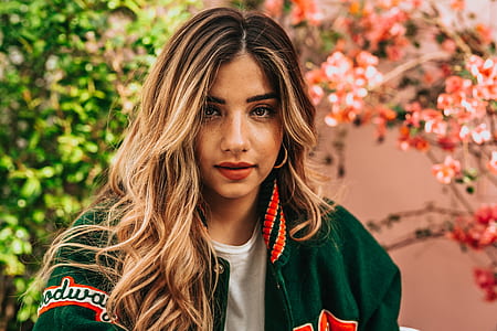 woman wearing green jacket thumbnail