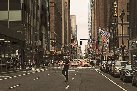 man crossing in the middle of the road thumbnail