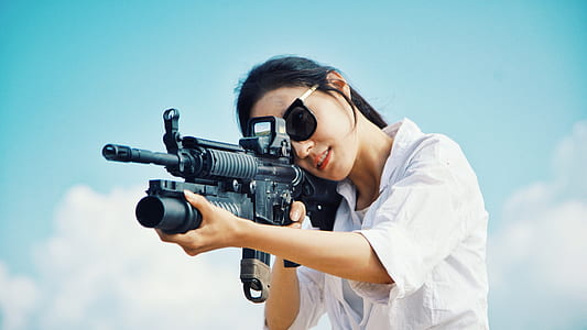woman holding assault rifle thumbnail