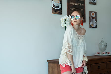 woman standing beside brown wooden sideboard thumbnail