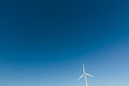 white wind mill under blue sky thumbnail