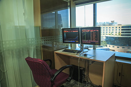 two black flat screen monitors on table thumbnail