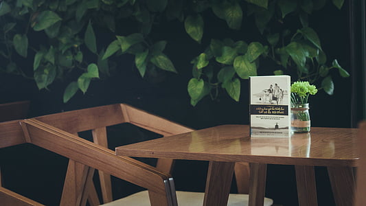 white book on top of table thumbnail