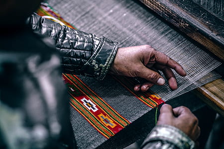 Person Making Textile on Manual Machine thumbnail