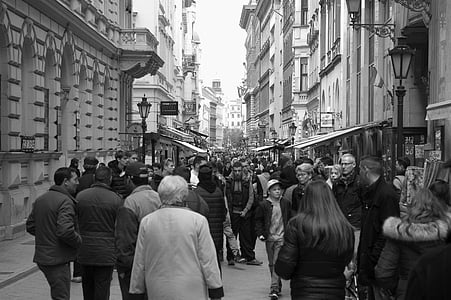 grayscale photo of group of people walking along road thumbnail
