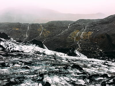 photo of gray mountain range under white sky thumbnail
