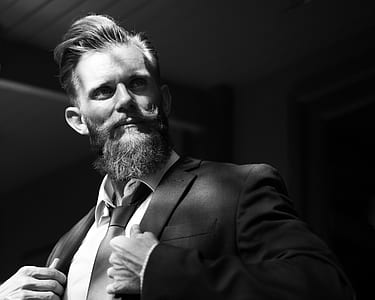 grayscale photo of man wearing notched lapel blazer thumbnail