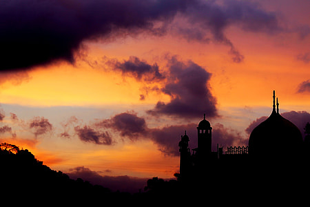 mosque near mountain during golden hour silhouette landscape photography thumbnail