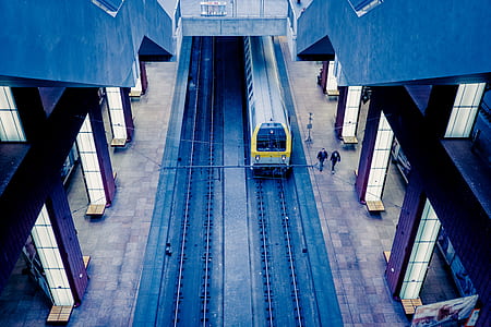 two person walking beside train thumbnail
