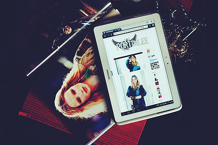 white Samsung tablet on table thumbnail