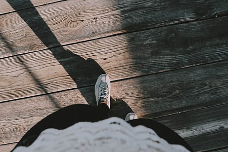 Person Wearing White Lace-up Shoes thumbnail