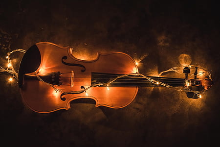 brown and black violin with white string lights thumbnail