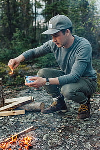 man ducking while holding safety match thumbnail
