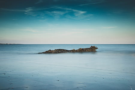 island under blue sky thumbnail