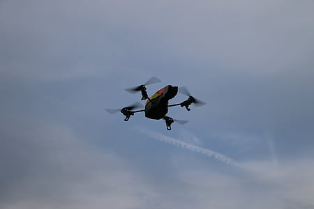 black and orange drone under white clouds during daytime thumbnail