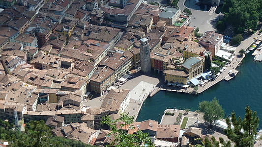 aerial photography of houses near sea at daytime thumbnail