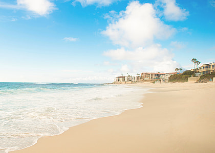 seashore under clouds during daytime thumbnail