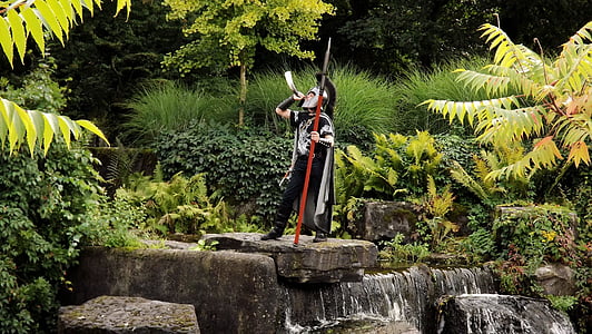 person wearing spartan costume near green leaf plant thumbnail