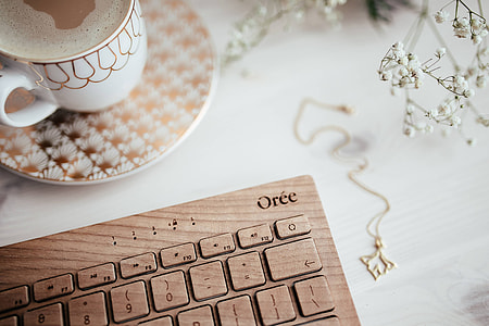 Wooden keyboard and cup of coffee thumbnail