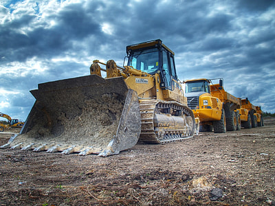 close up of front end loader on soil ground thumbnail