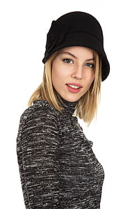 woman wearing black knit hat and black top thumbnail