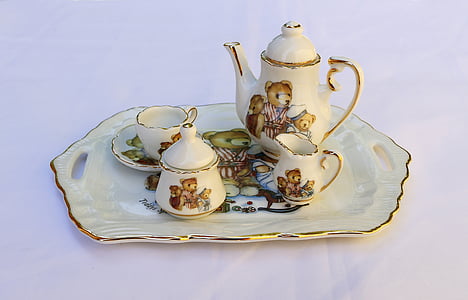 white ceramic teapot set in tray thumbnail