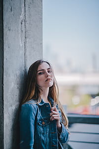 woman wearing blue denim button-up jacket thumbnail