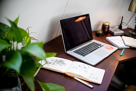 silver laptop on desk thumbnail