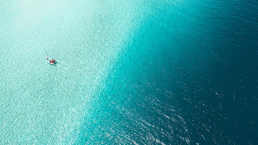 aerial photography of person in seashore thumbnail
