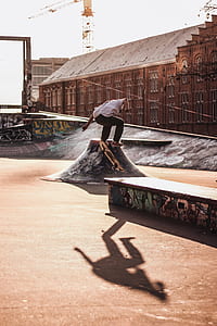 man tricking skateboard on skate park thumbnail