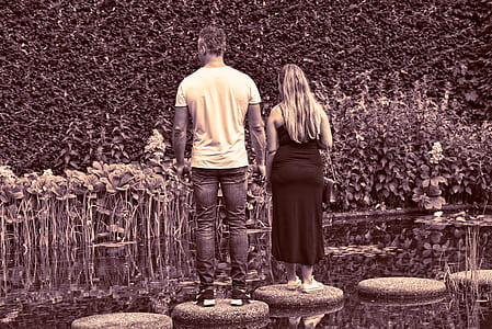 man and woman standing on stone steps thumbnail