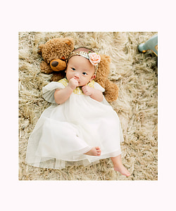 girl lying on brown suede carpet thumbnail