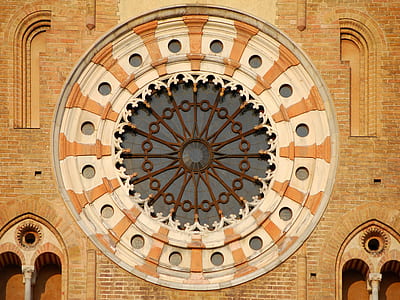 brown and white brick cathedral under sunlight thumbnail