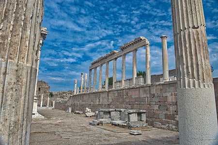 white concrete column ruins under blue sky thumbnail