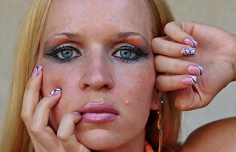 woman putting her hand hand on her face thumbnail