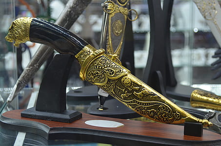 black and gold dagger thumbnail