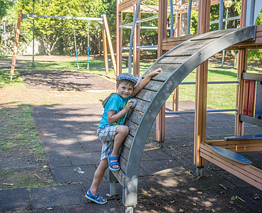 boy leaning on the wooden arch thumbnail