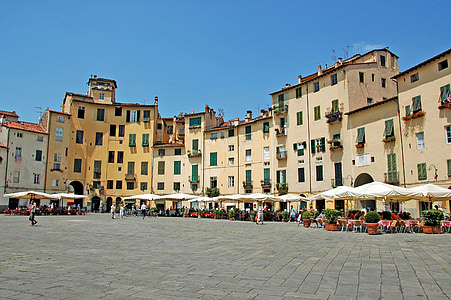 gray buildings near patio hats thumbnail
