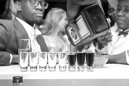 person filling rock glasses thumbnail