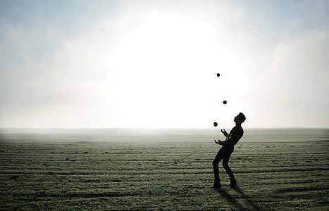 man juggling on clear field thumbnail