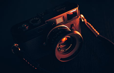 black DSLR camera thumbnail