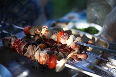 meat and vegetable skewers in grill thumbnail