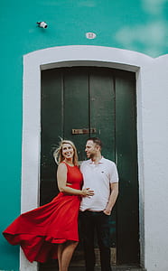 man and woman hugging near door thumbnail