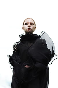 woman taking photo with white background thumbnail