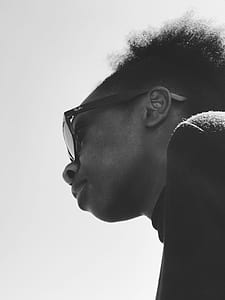 grayscale photography of man wearing sunglasses thumbnail
