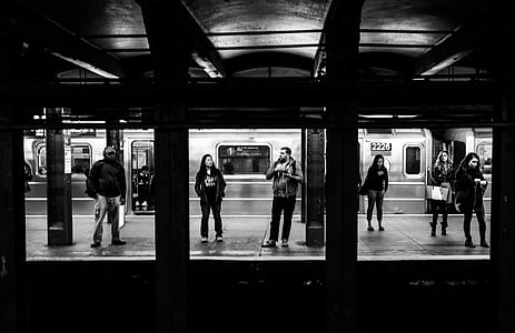 grayscale photography of people on subway thumbnail