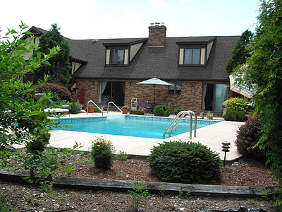 brown house with swimming pool thumbnail