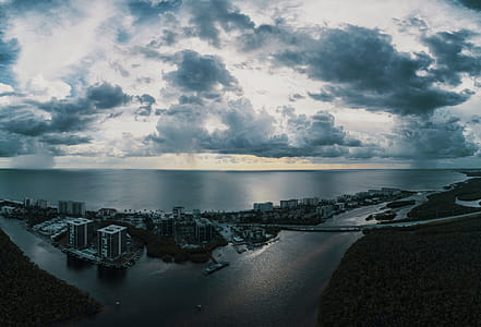 Scenic View of Ocean Under Cloudy Sky thumbnail