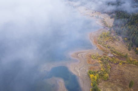 aerial photography of island near sea thumbnail